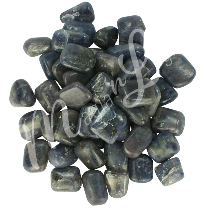 Collection of polished tumbled stones in shades of gree, purple, blue, and black, arranged together in a circular pile.