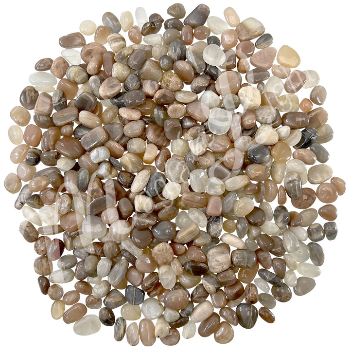 Collection of polished tumbled stones in shades of gray, brown, and cream, arranged together in a circular pile.