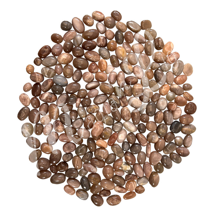 Collection of polished tumbled stones in shades of orange, brown, and gray, arranged together in a circular pile.
