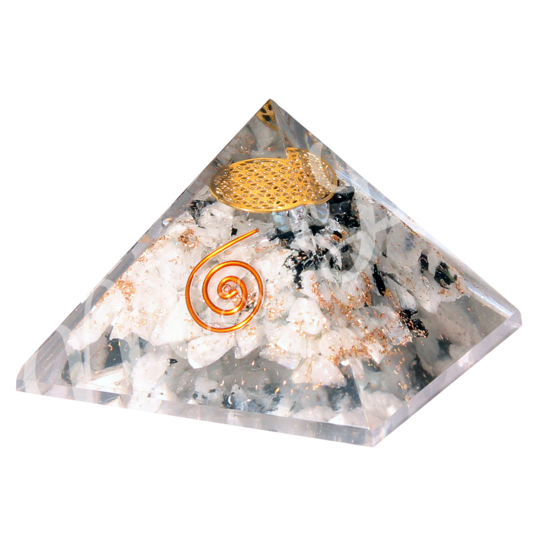 A four side pyramid made of Rainbow Moonstone in Orgone, featuring the flower of life symbol inside and a copper spiral on one side.
