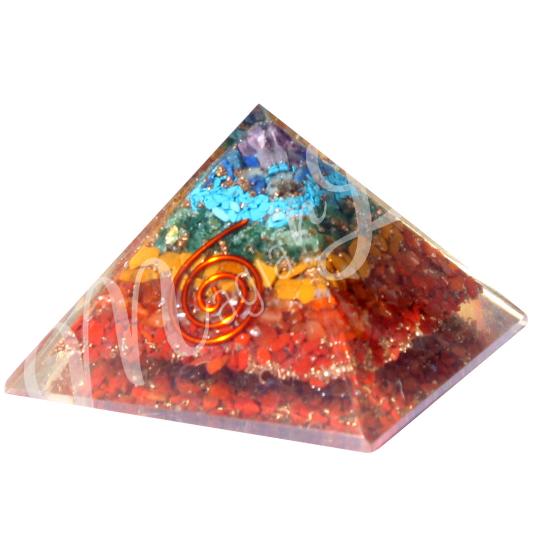 A four side pyramid made of 7 chakras chips in Orgone, featuring a copper spiral on one side.
