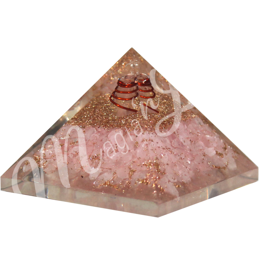 A four side pyramid made of Rose Quartz in Orgone with copper spiral.
