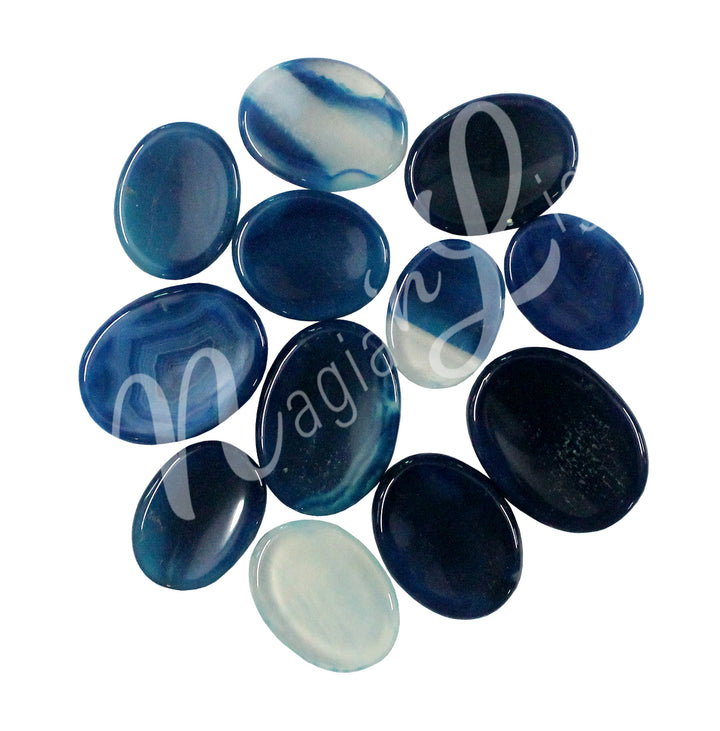 A collection of polished blue, white and dark blue stones with smooth, oval shapes, showing natural color variations and patterns.