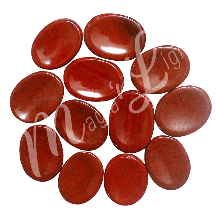 A collection of polished red stones with smooth, oval shapes, showing natural color variations and patterns.