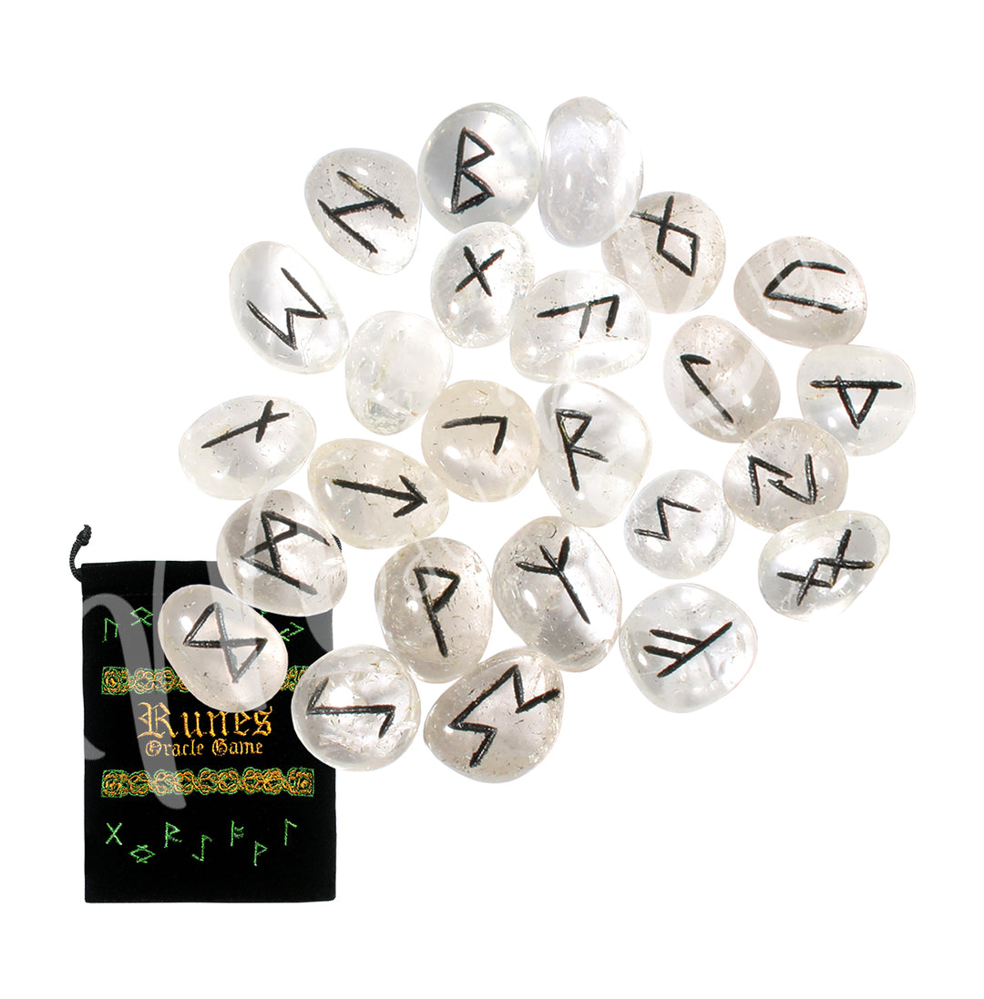 A set of crystal quartz runestones with engraved and painted black symbols, displayed with a black velvet pouch. The pouch is embroidered with the words "runes oracle game", as well as runic symbols.