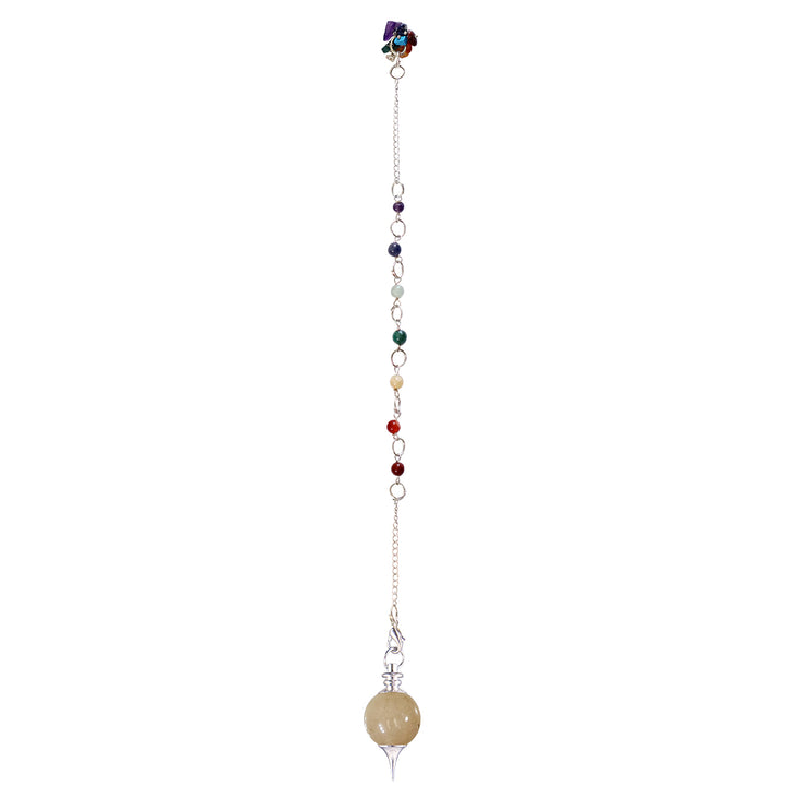 Silver pendulum with a yellow jasper spherical stone and a pointed metal tip, suspended from a silver chain ans chakra beads with chakra chips at the end.
