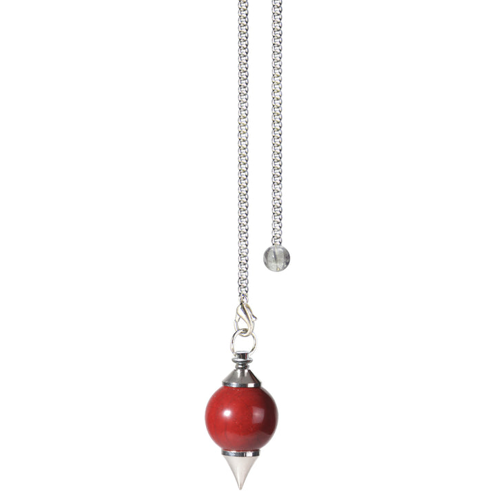 Silver pendulum with a red jasper spherical stone and a pointed metal tip, suspended from a silver chain with a small clear bead at the end.