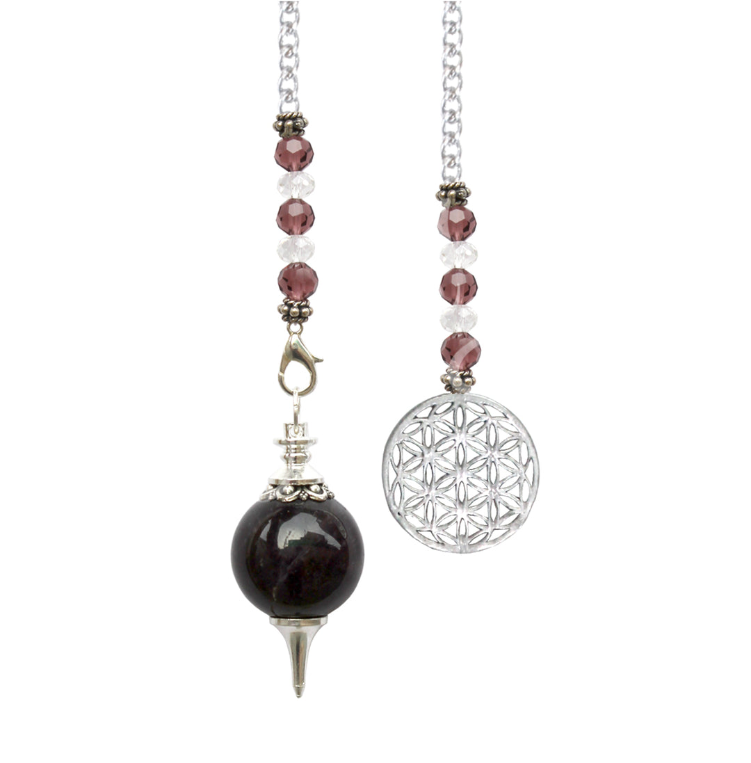 Silver pendulum with an amethyst spherical stone and a pointed metal tip, suspended from a silver chain and purple beads with a flower of life charm at the end.