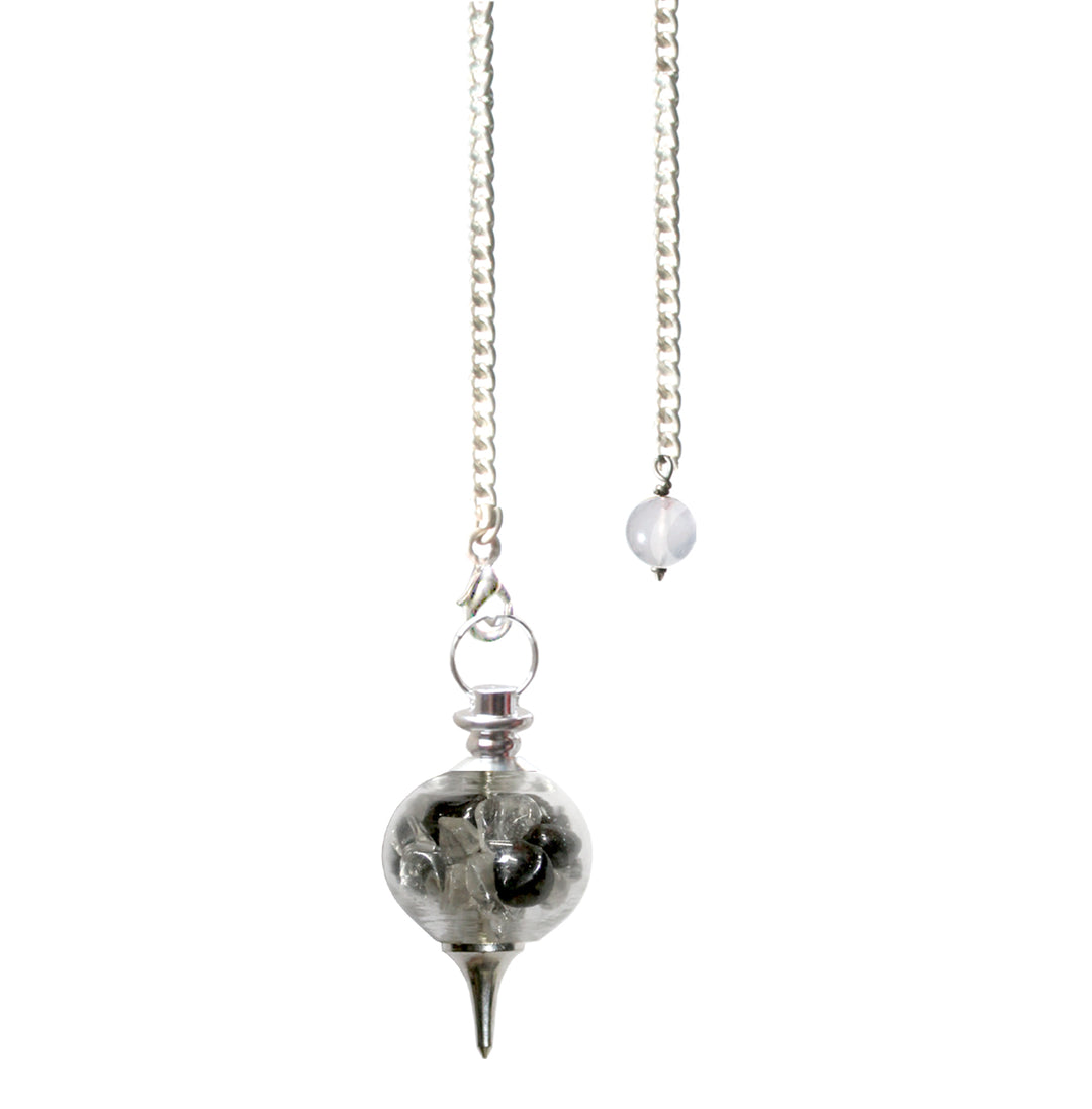 Silver pendulum with a spherical clear chamber filled with crystal quartz & hematite chips, finished with a pointed metal tip and suspended from a silver chain with a small round bead at the end.