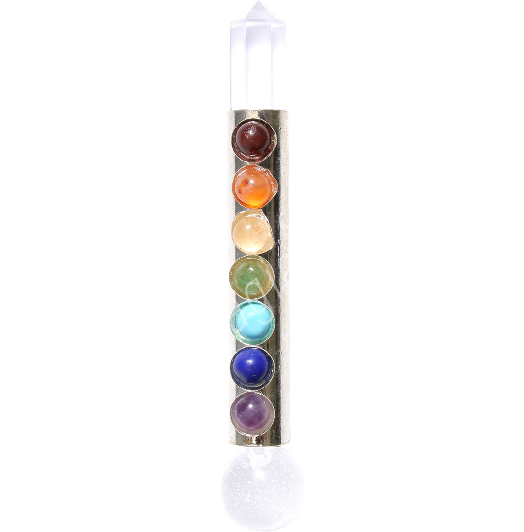 a wand made from a metal body adorned with the 7 chakras as small spheres. One end is a clear crystal point, the other is a sphere.