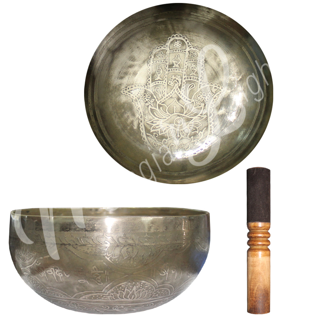 3 items from the left to right:
A Singing bowl with a rounded shape,  hand of fatima engraved seen from above. The same singing bowl seen from the side.
A wooden mallet.