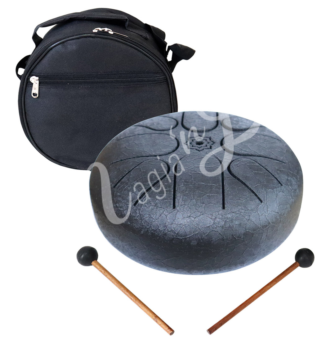 A black iron tongue drum, accompanied by two wooden mallets with black rubber heads and a round black carrying case.