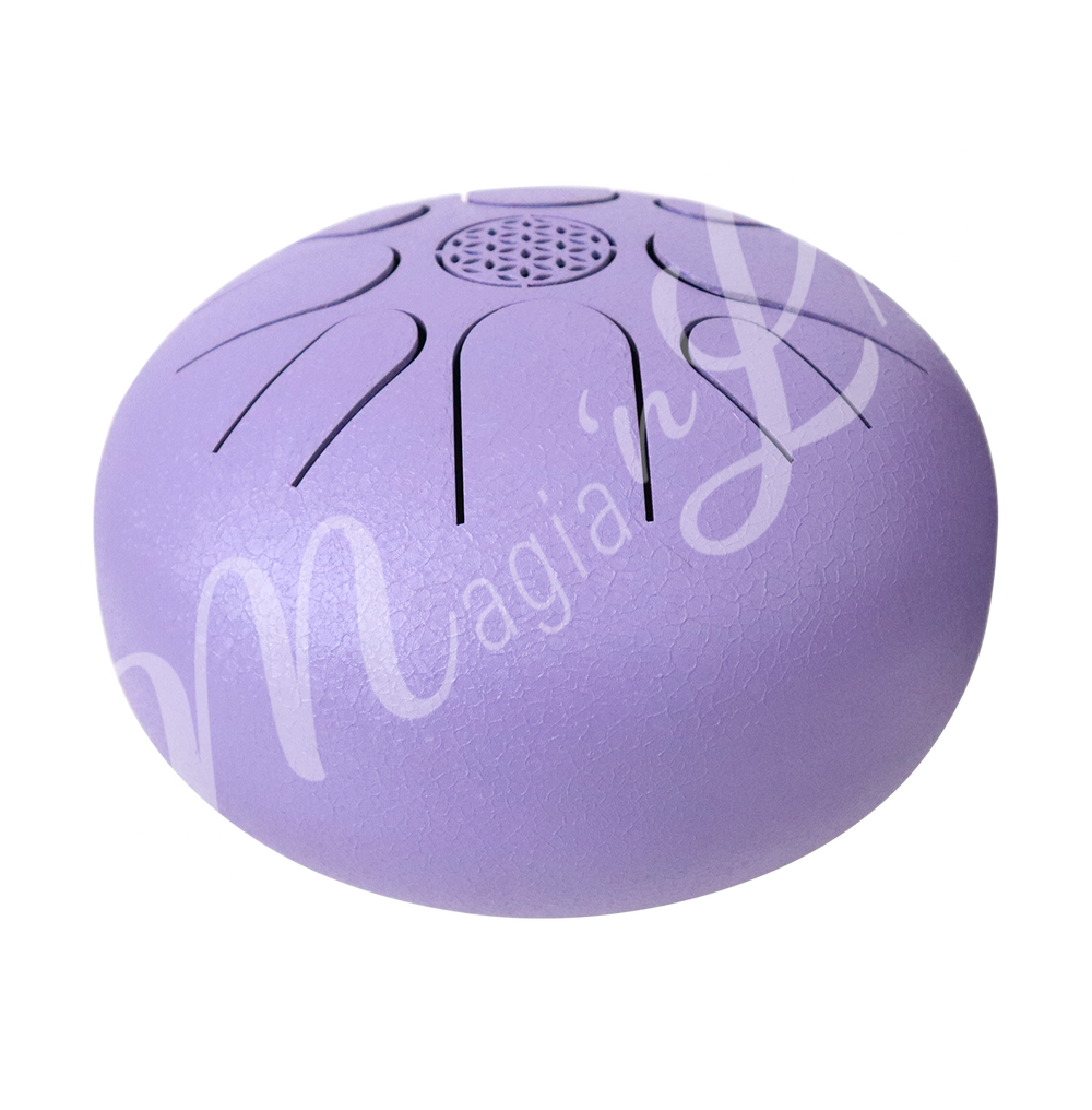 A purple iron tongue drum with a speckled finish, featuring multiple U-shaped cutout tongues and a flower of life symbol in the center. Seen from the side.