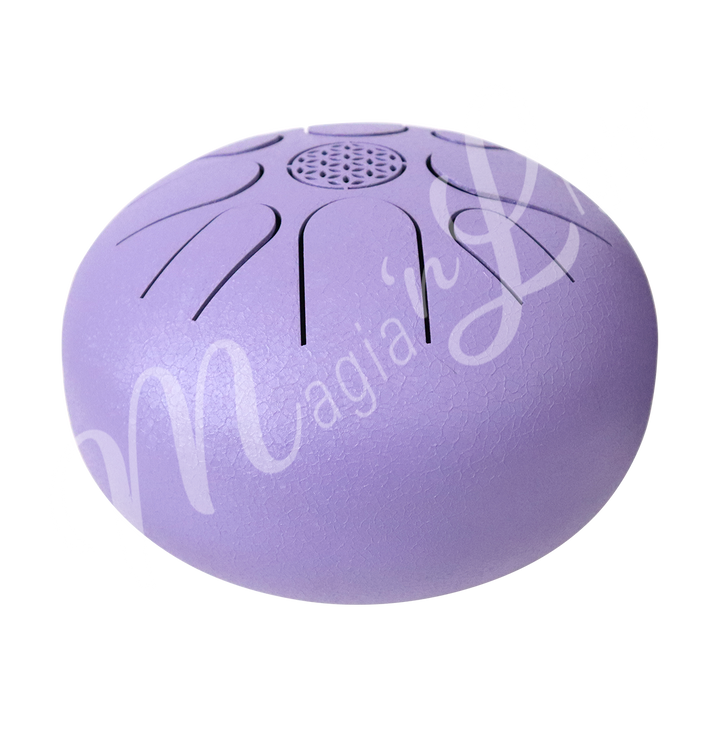 A purple iron tongue drum with a speckled finish, featuring multiple U-shaped cutout tongues and a flower of life symbol in the center. Seen from the side.