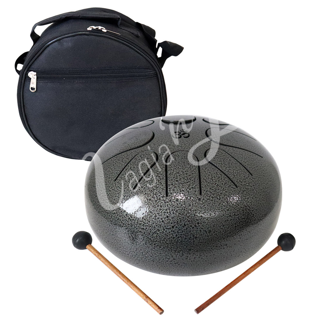 A gray iron tongue drum, accompanied by two wooden mallets with black rubber heads and a round black carrying case.