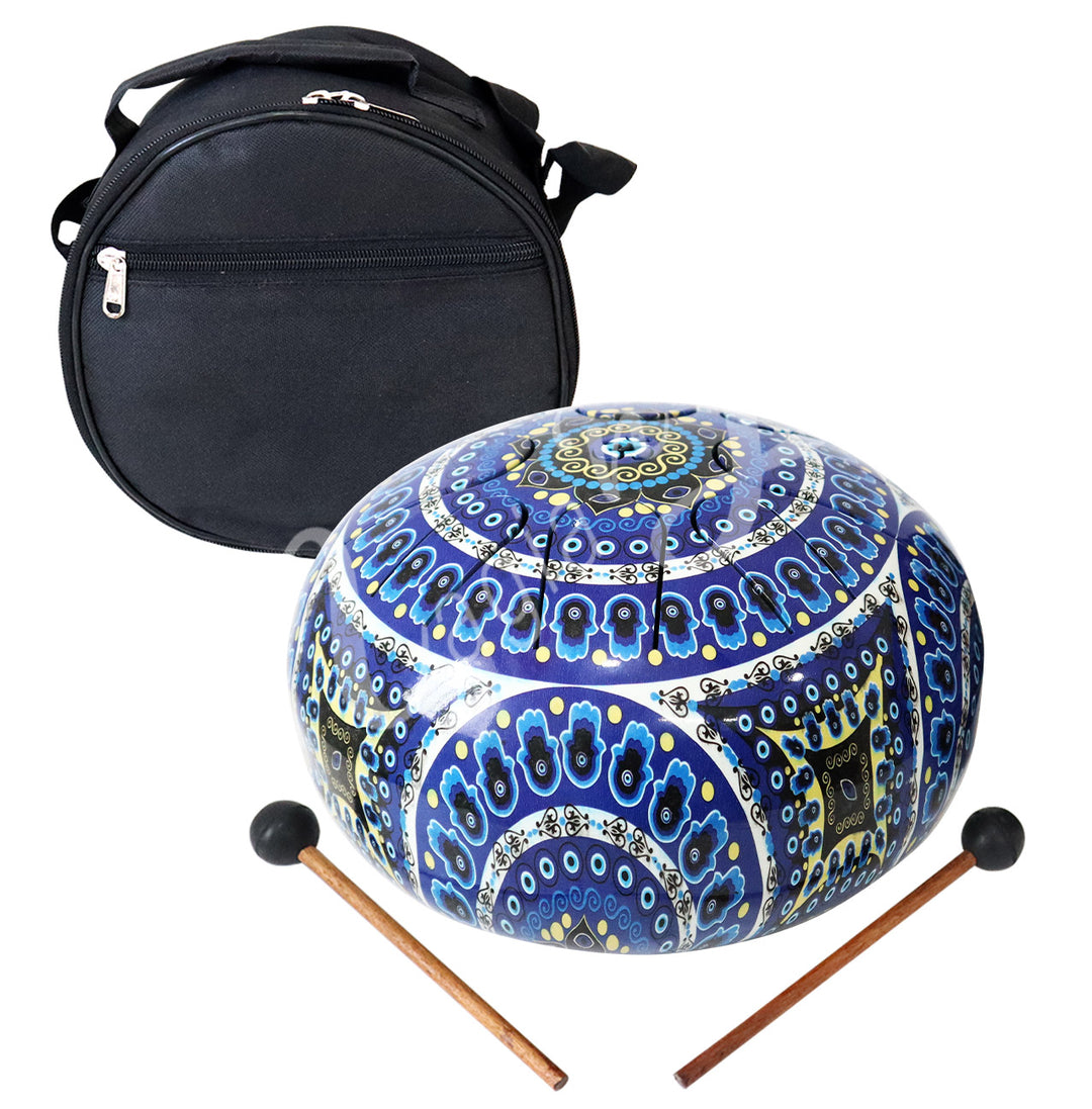 An iron tongue drum with a hand of Fatima with evil eye design, accompanied by two wooden mallets with black rubber heads and a round black carrying case.