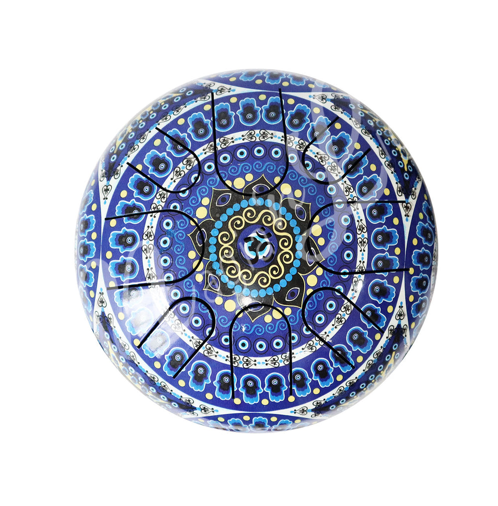 A top view of an iron tongue drum with a speckled finish, featuring multiple U-shaped cutout tongues and the hand of fatima with evil eye design.