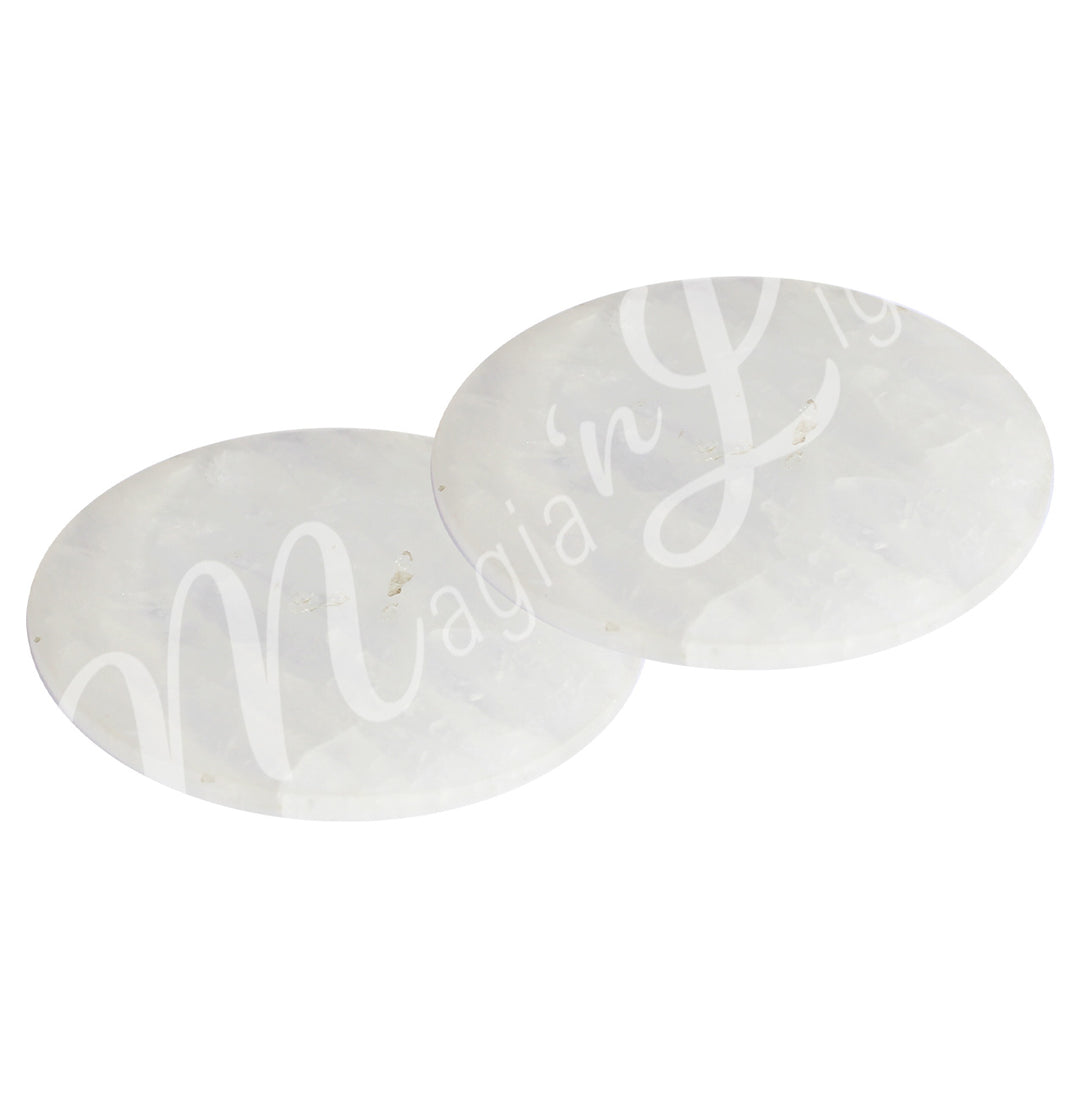 Two round crystal quartz coasters