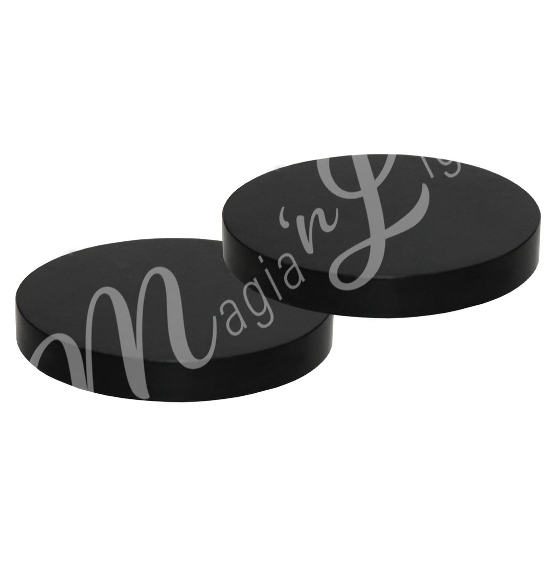 Two round black tourmaline coasters.