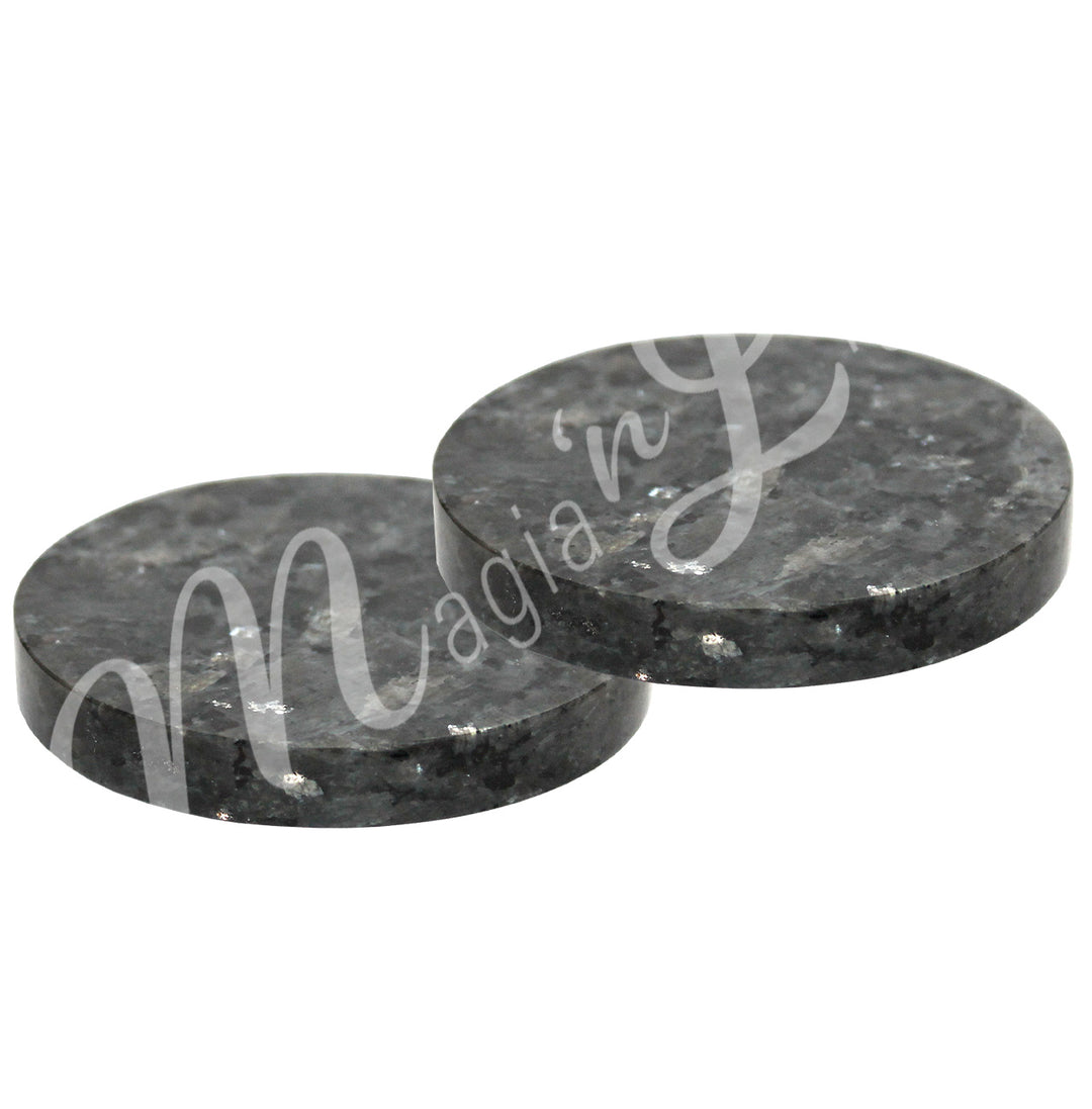 Two round larvikite coasters.