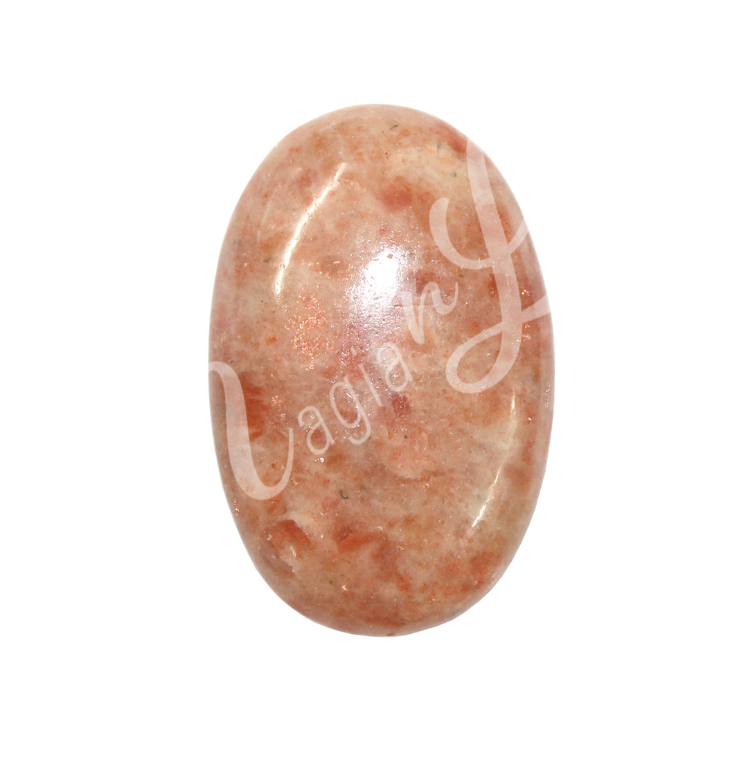 Close-up of a polished oval palm stone made of sunstone.