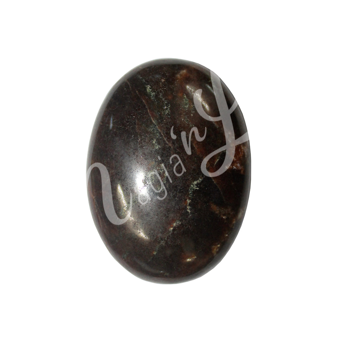 Close-up of a polished oval palm stone made of Garnet.