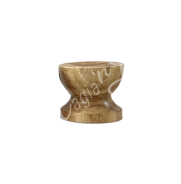A wooden holder with a round and wide base.
