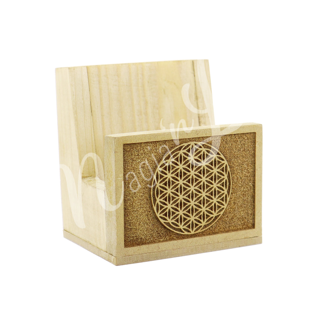 A wooden stand for slices, featuring an engraved Flower of Life design at the front.