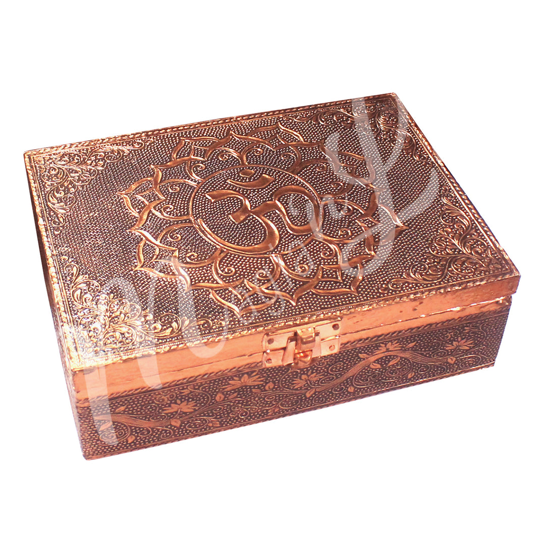 A box made of copper-plated metal features many lotus flowers. The lid displays an OM symbol within a lotus flower.