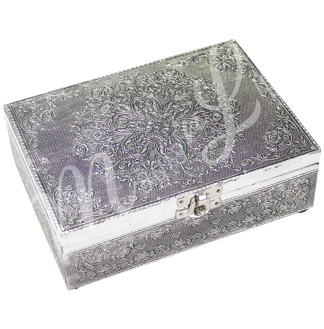 A metal box features a mandala design on the lid.
