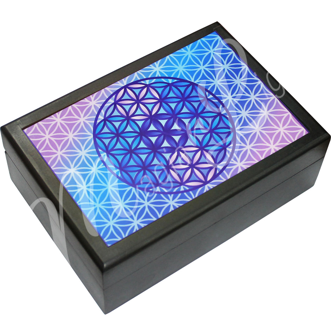 A printed wooden box features a Flower of Life design, with a blue and purple Flower of Life symbol at the center.