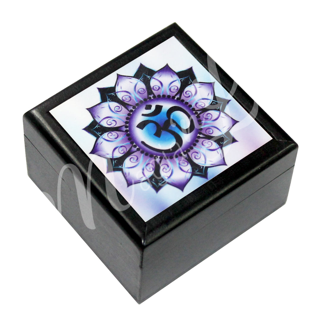 A printed wooden box features an OM in a lotus flower design in purple, black and white colors.
