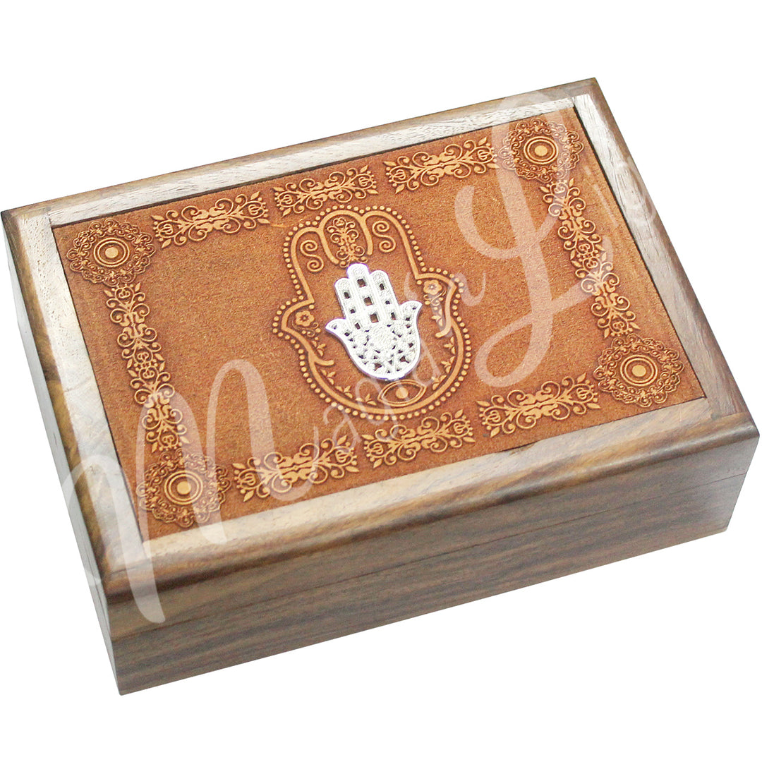 A box made of acacia wood. The lid features a metal Hand of Fatima in a hand of Fatima symbol surrounded by various symbols.