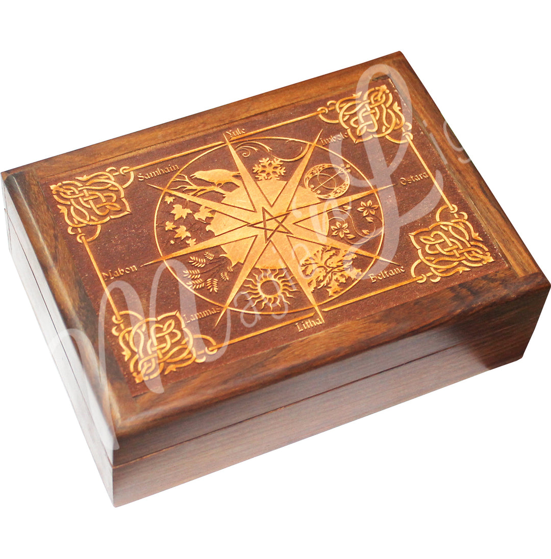 A box made of acacia wood. The lid features a laser-engraved pagan calendar.
