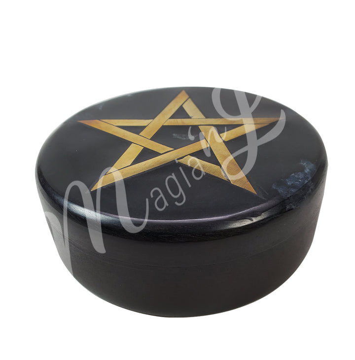A round box made of soapstone features an inlaid pentacle in gold color on the lid.