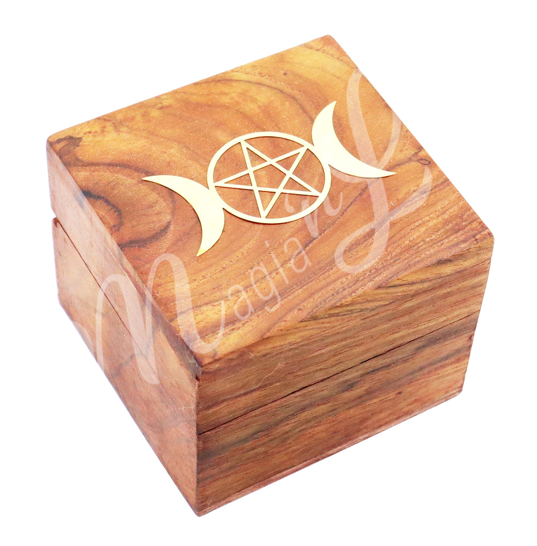 A box made of acacia wood. The lid is adorned with a brass triple moon symbol, featuring a pentacle at the center of the full moon.