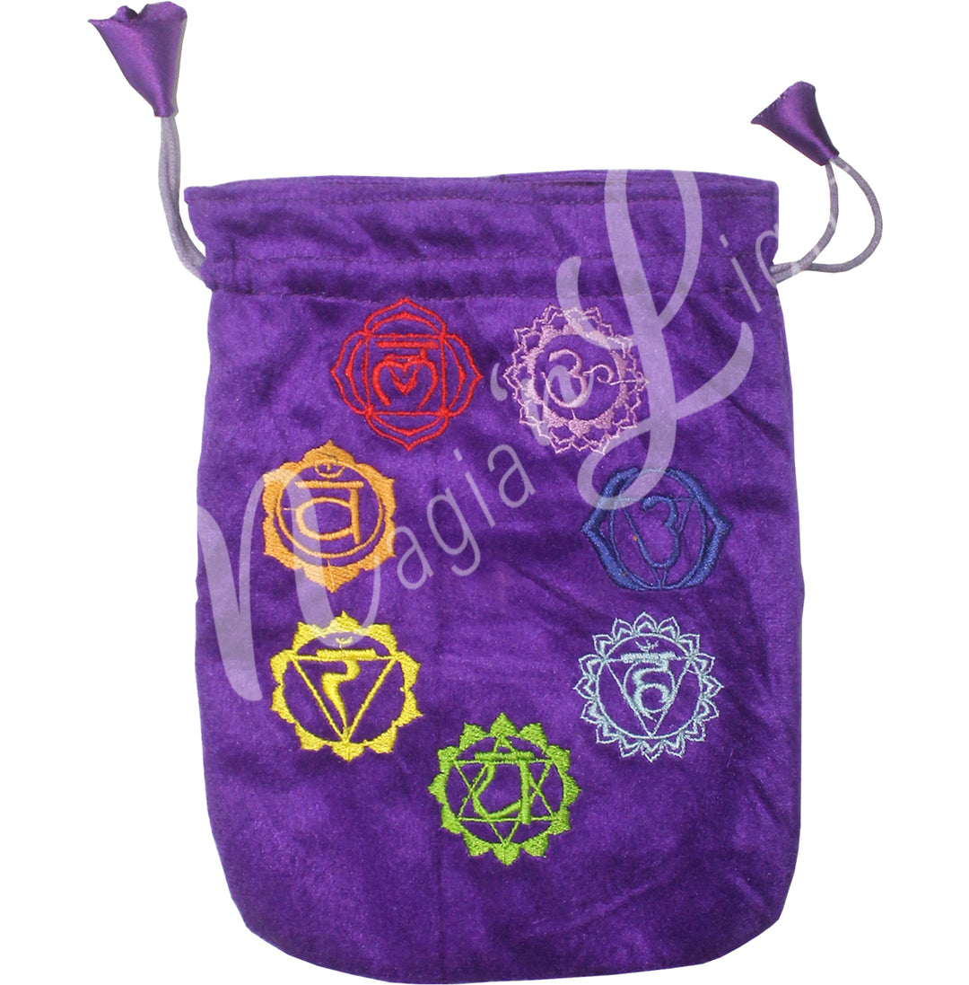 A purple bag featuring an embroidered of the seven chakra symbols in their respective color.