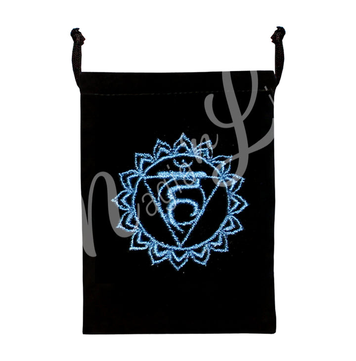 A black bag featuring an embroidered throat chakra blue design