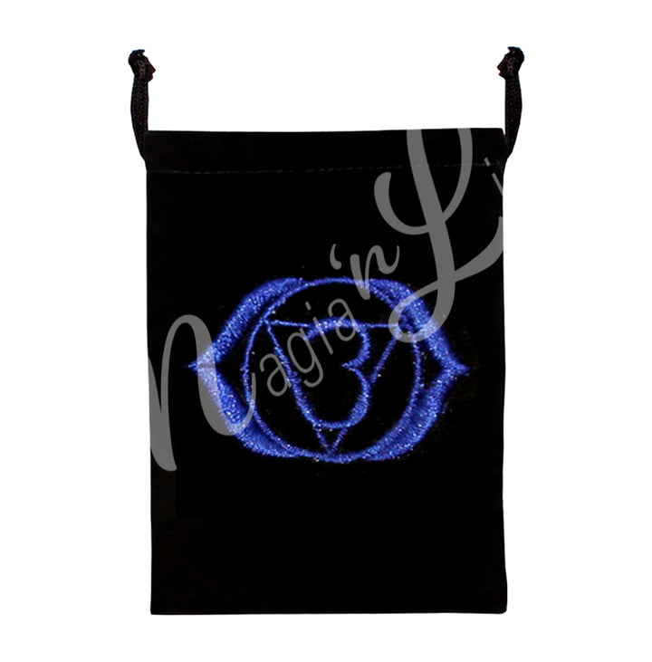 A black bag featuring an embroidered third eye chakra indigo design