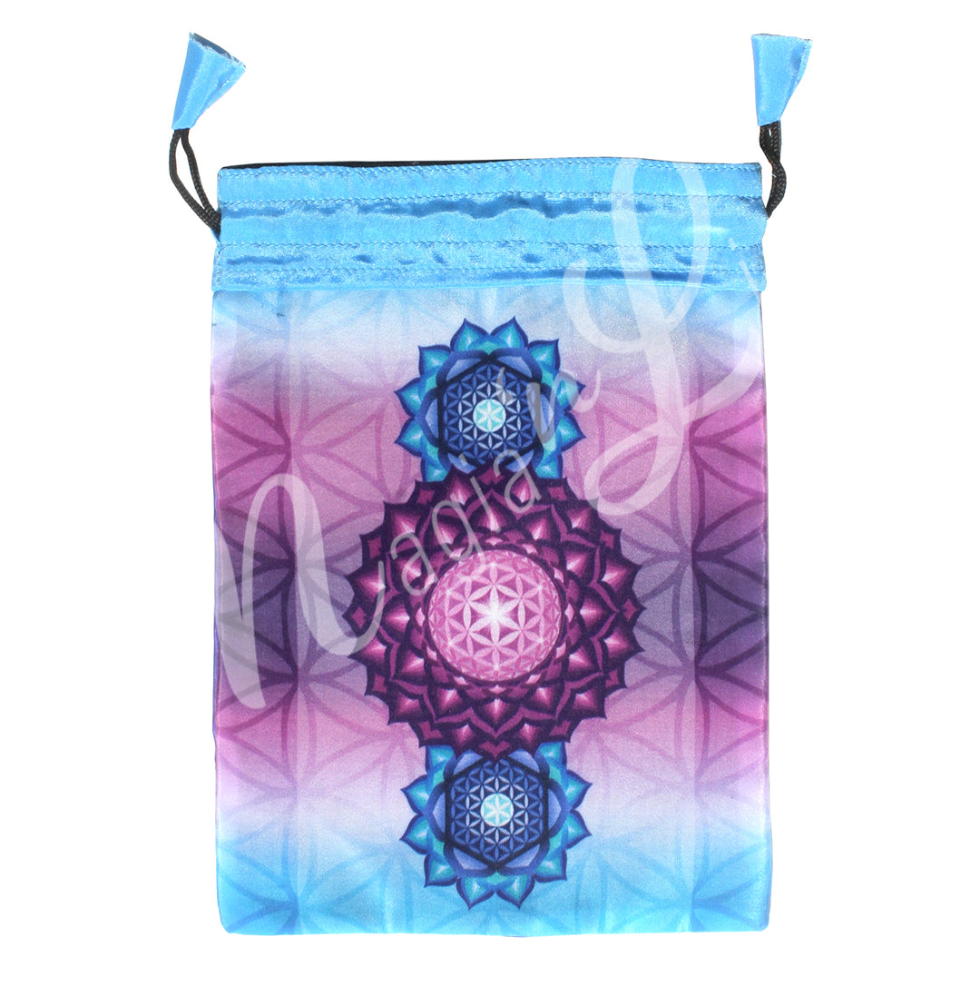 A turquoise drawstring pouch with a mystical design featuring lotus flowers in pink and blue tones, surrounded by decorative Flower of Life design.