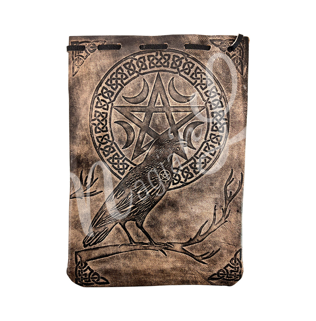 A brown bag made of leather featuring a crow and a pentacle surround by a circle celtic knot.