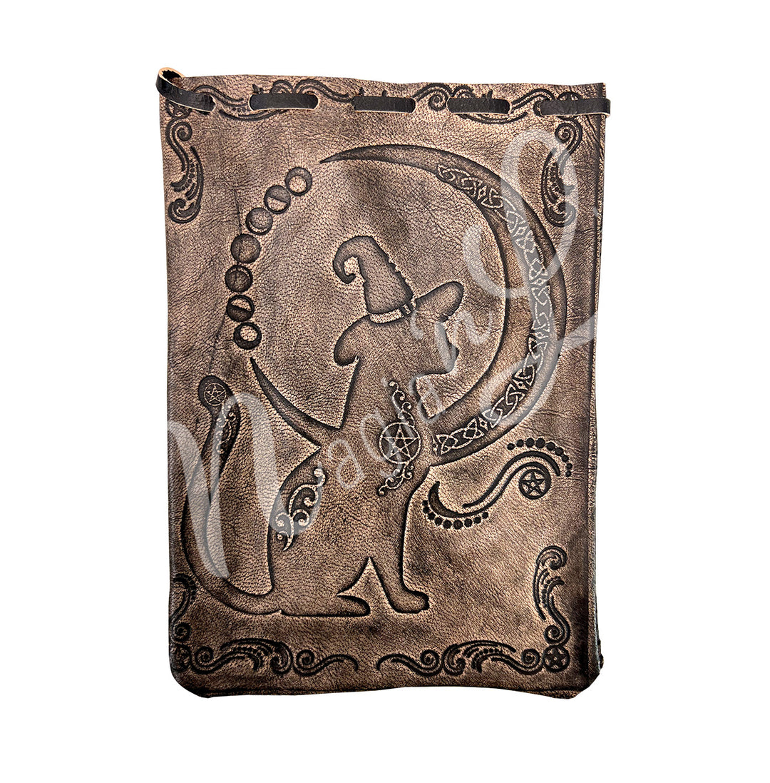 A brown bag made of leather, featuring a cat with a moon. The moon has a celtic knot design.