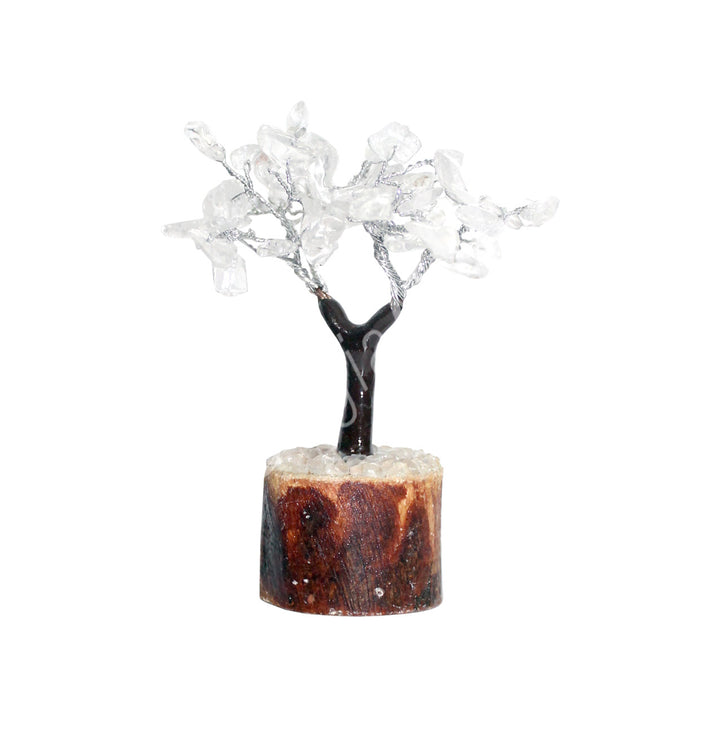 A wire gemstone bonsai tree with crystal quartz chips, mounted on a natural base.