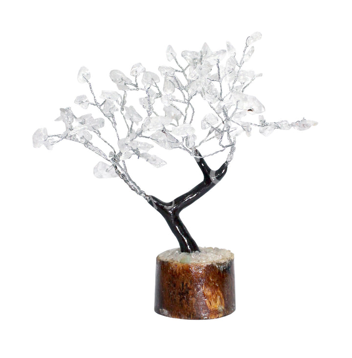 A wire gemstone bonsai tree with crystal quartz chips, mounted on a natural base.