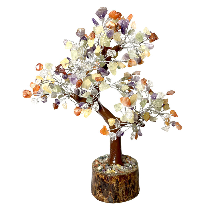 A wire gemstone bonsai tree with mixed stone chips, mounted on a natural base.