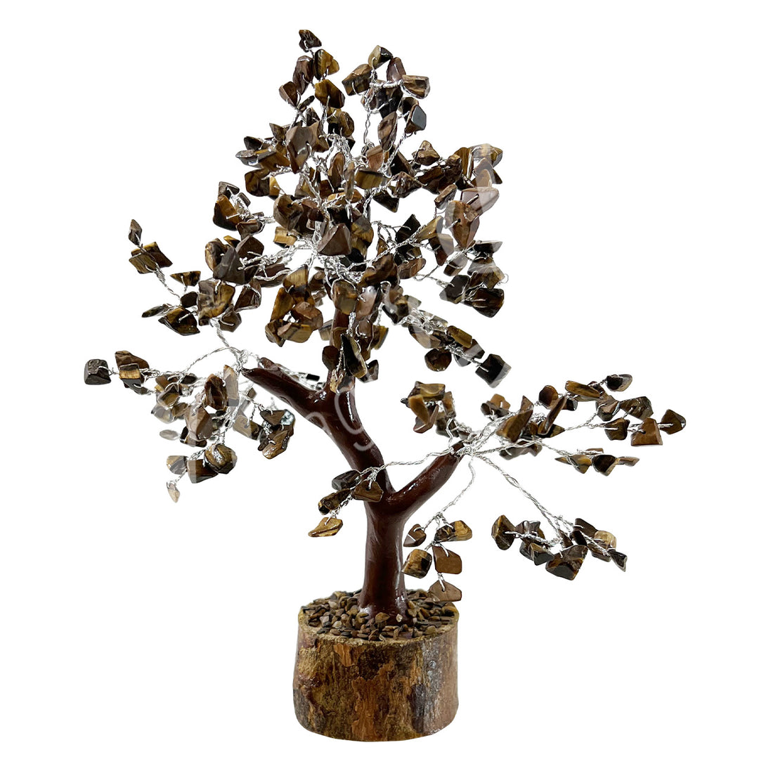 A wire gemstone bonsai tree with tiger eye crystal chips, mounted on a natural base.