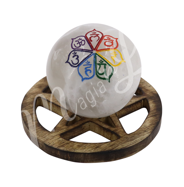 A white sphere with the seven chakras symbol with their respective color on a pentacle stand made of mango wood.