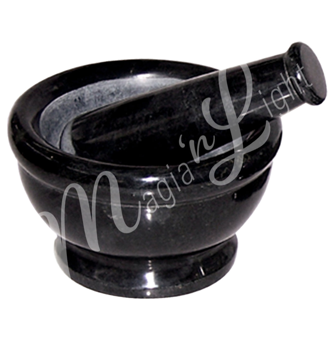 Black soapstone mortar and pestle set.