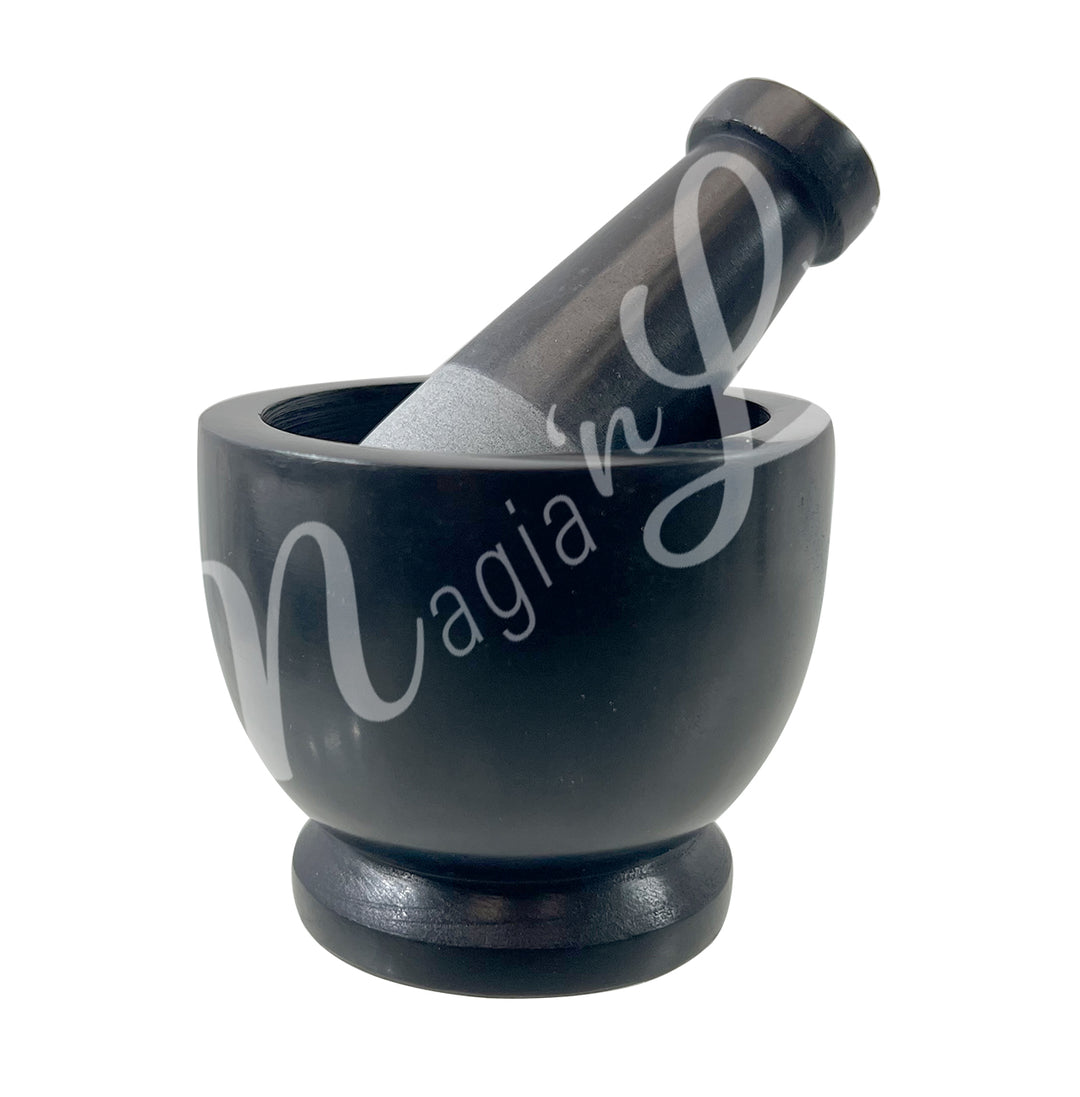 Black soapstone mortar and pestle set.