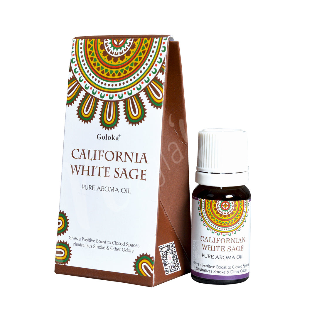 Rectangular box of Goloka California White Sage Pure Aroma Oil, decorated with a green, yellow, and brown mandala design on a white background. Text on the front highlights its odor-neutralizing and space-cleansing properties. Beside the product bottle with the same label.